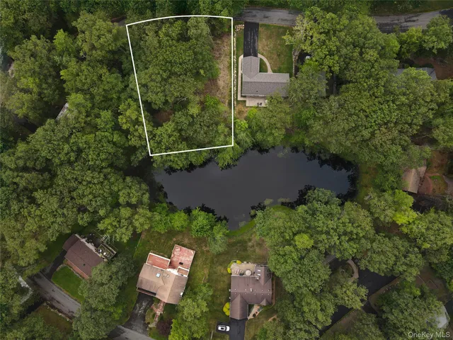 an aerial view of house with yard