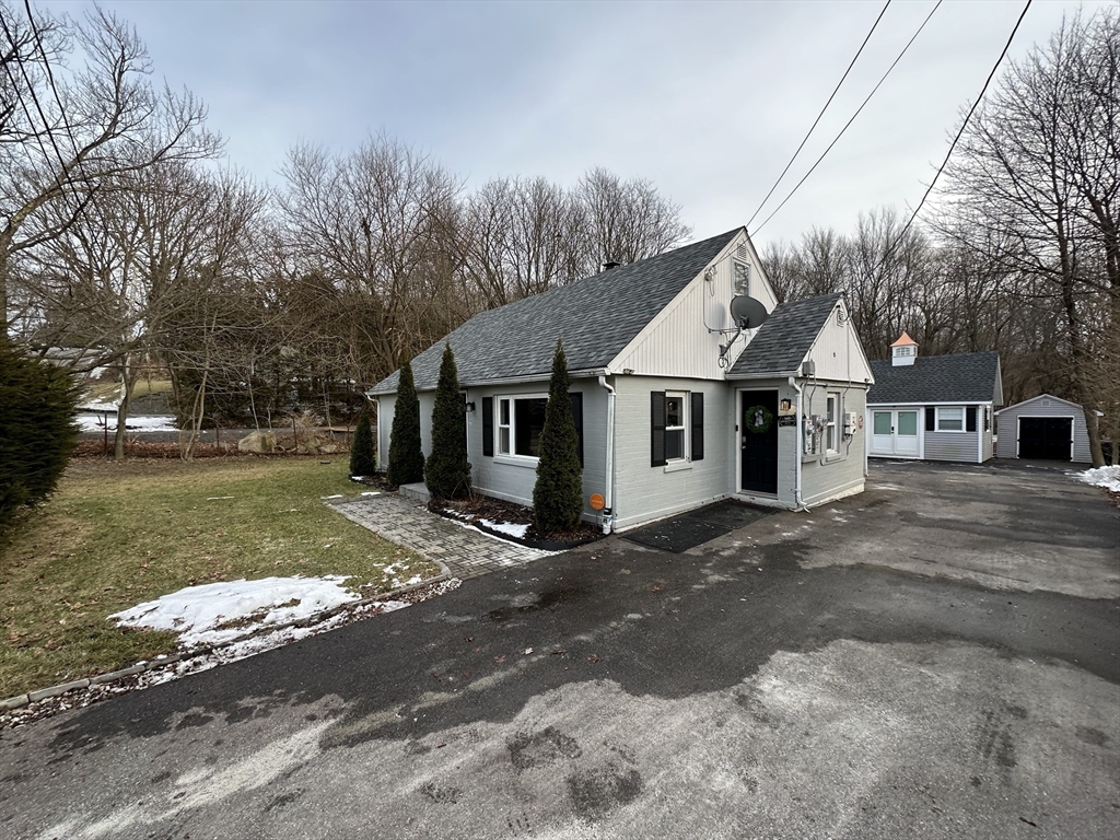 37 Tyson Road Worcester, MA 01606 - Photo 2 of 18 a view of a white house with a large space and a road view