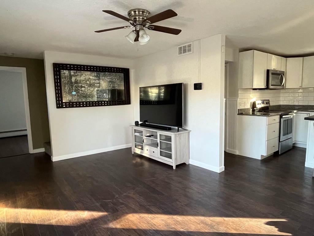 37 Tyson Road Worcester, MA 01606 - Photo 6 of 18 a living room with stainless steel appliances furniture and a flat screen tv