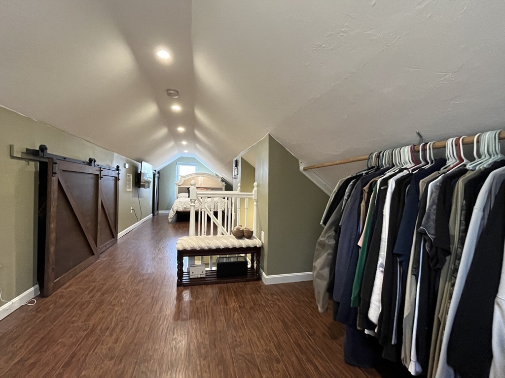 37 Tyson Road Worcester, MA 01606 - Photo 9 of 18 a view of a hallway with wooden floor and stairs