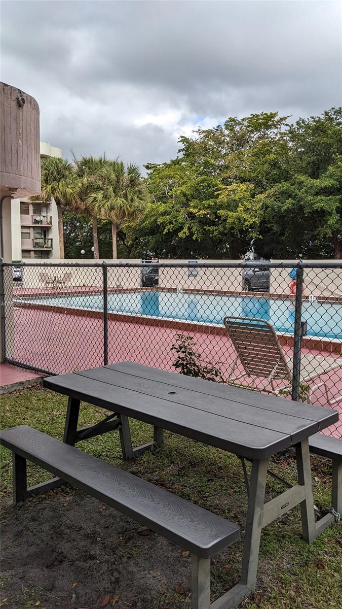 2701 Riverside Drive, Unit 206B Coral Springs, FL 33065 - Photo 17 of 19 a view of a terrace with sitting area