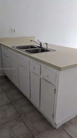 a view of cabinets and sink