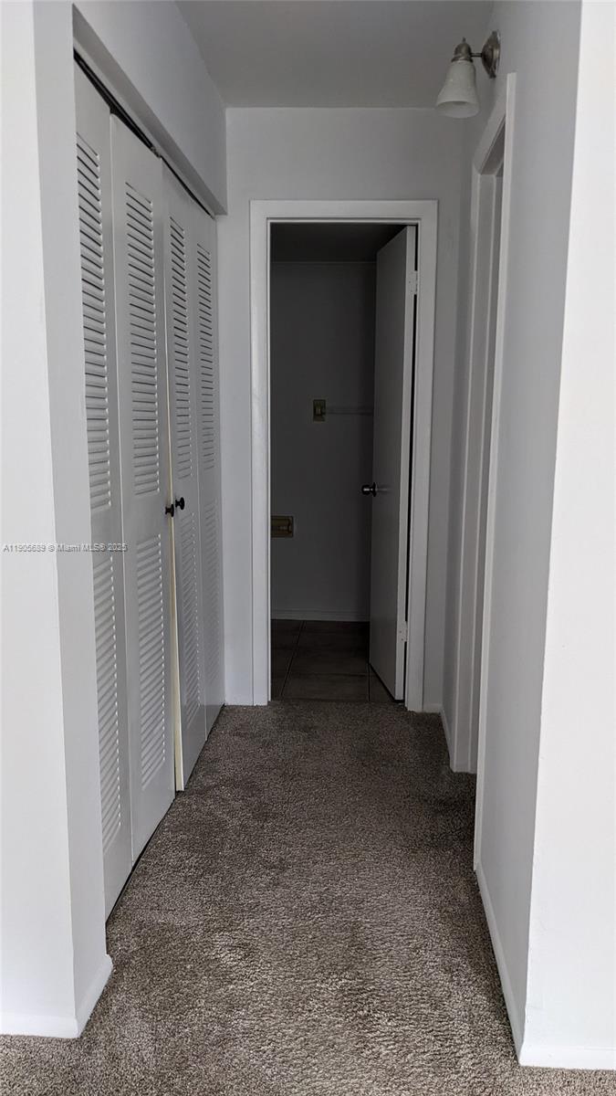 2701 Riverside Drive, Unit 206B Coral Springs, FL 33065 - Photo 5 of 19 a view of a hallway to rooms
