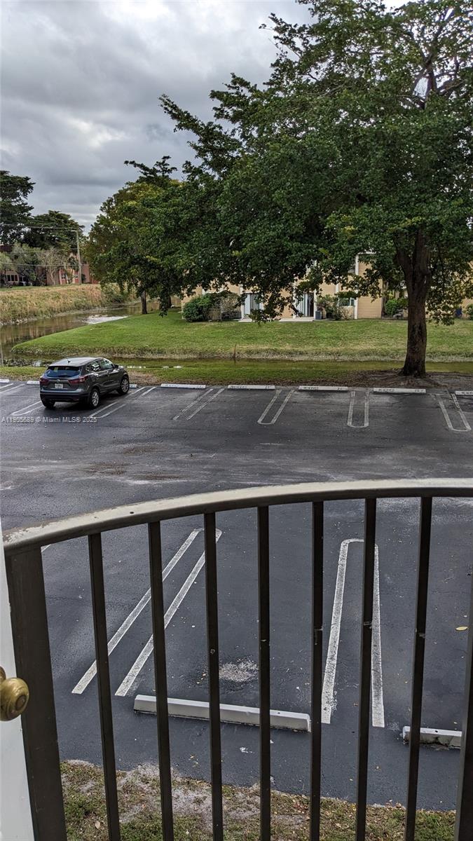2701 Riverside Drive, Unit 206B Coral Springs, FL 33065 - Photo 10 of 19 a view of a yard with furniture and a lake view
