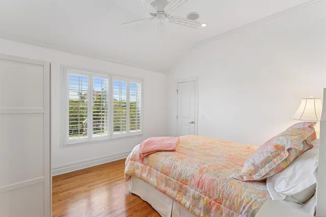 a bedroom with a bed and a window with outer view
