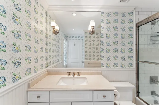 a bathroom with a bathtub and shower