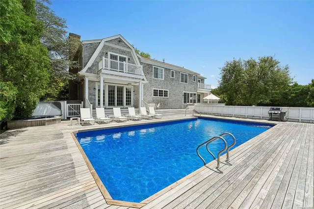 a view of a swimming pool with a patio