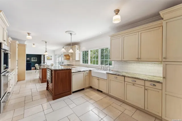 a kitchen with sink cabinets and window