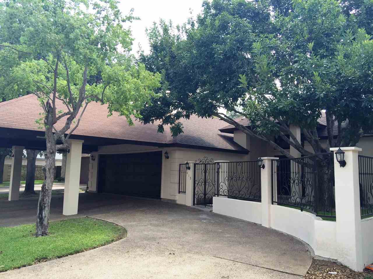 415 Cayman Court Laredo, TX 78045 - Photo 18 of 18 a front view of a house with a yard garage and outdoor seating