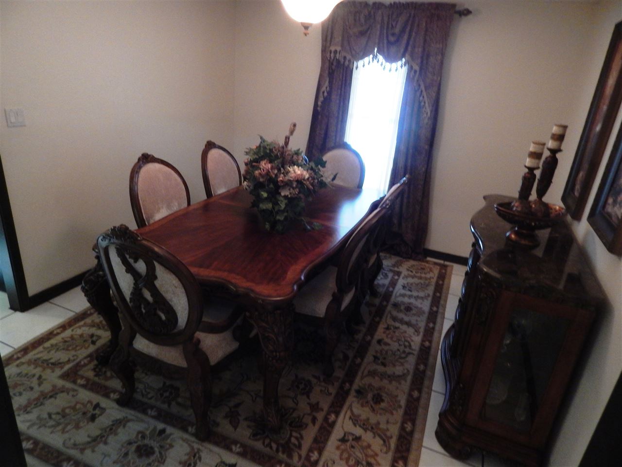 415 Cayman Court Laredo, TX 78045 - Photo 3 of 18 a view of a room with a table and chairs
