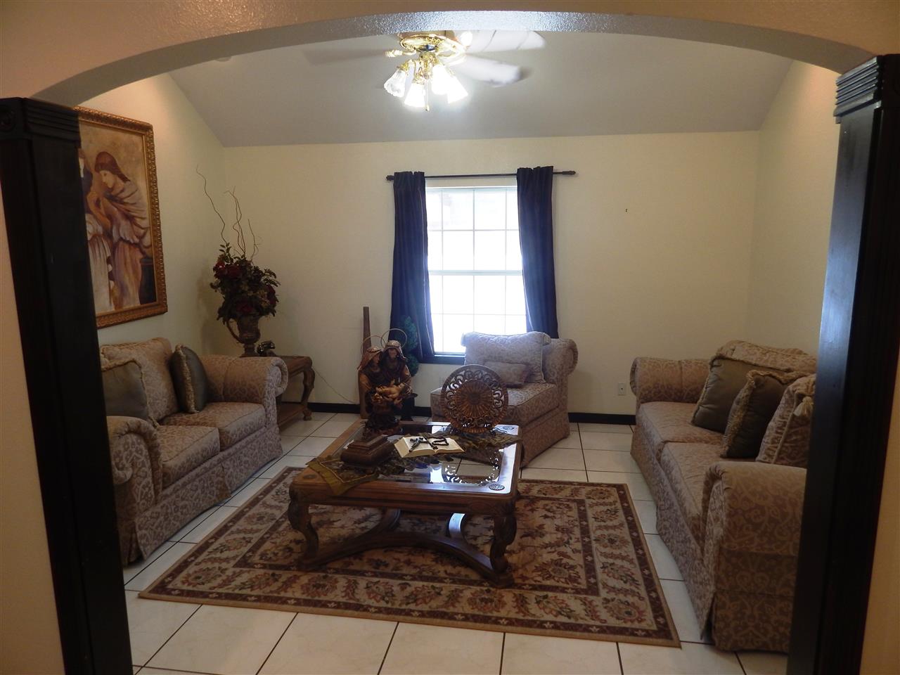 415 Cayman Court Laredo, TX 78045 - Photo 5 of 18 a living room with furniture and a chandelier