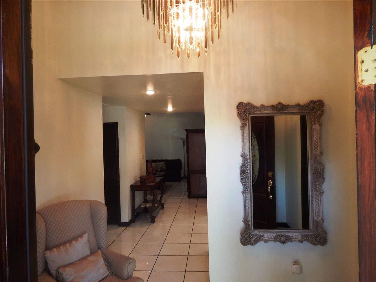 415 Cayman Court Laredo, TX 78045 - Photo 6 of 18 a view of a hallway with furniture and a living room