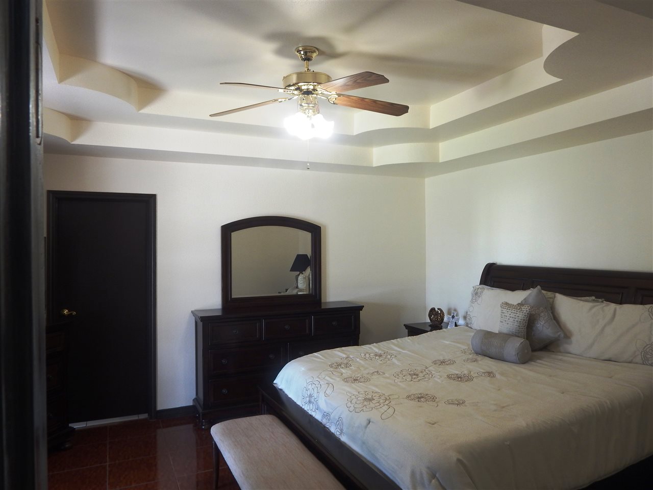 415 Cayman Court Laredo, TX 78045 - Photo 8 of 18 a bedroom with a bed and a dresser