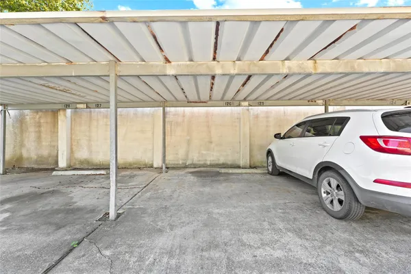 an aerial view of multiple houses with a yard
