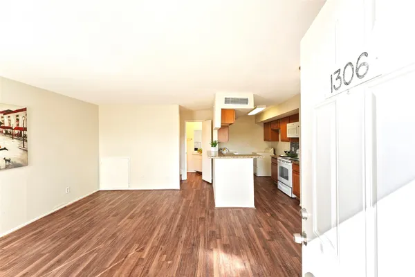 a view of a kitchen with wooden floor