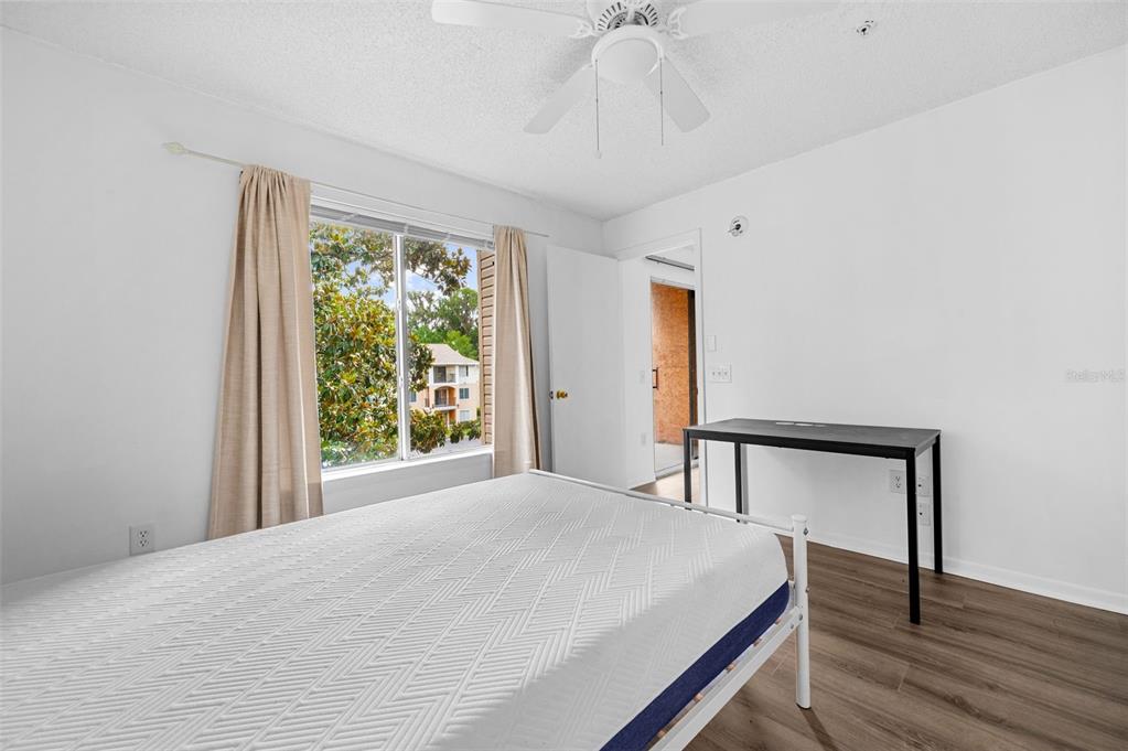 3921 Southwest 34th Street, Unit 208 Gainesville, FL 32608 - Photo 24 of 33 a bedroom with a bed and a window