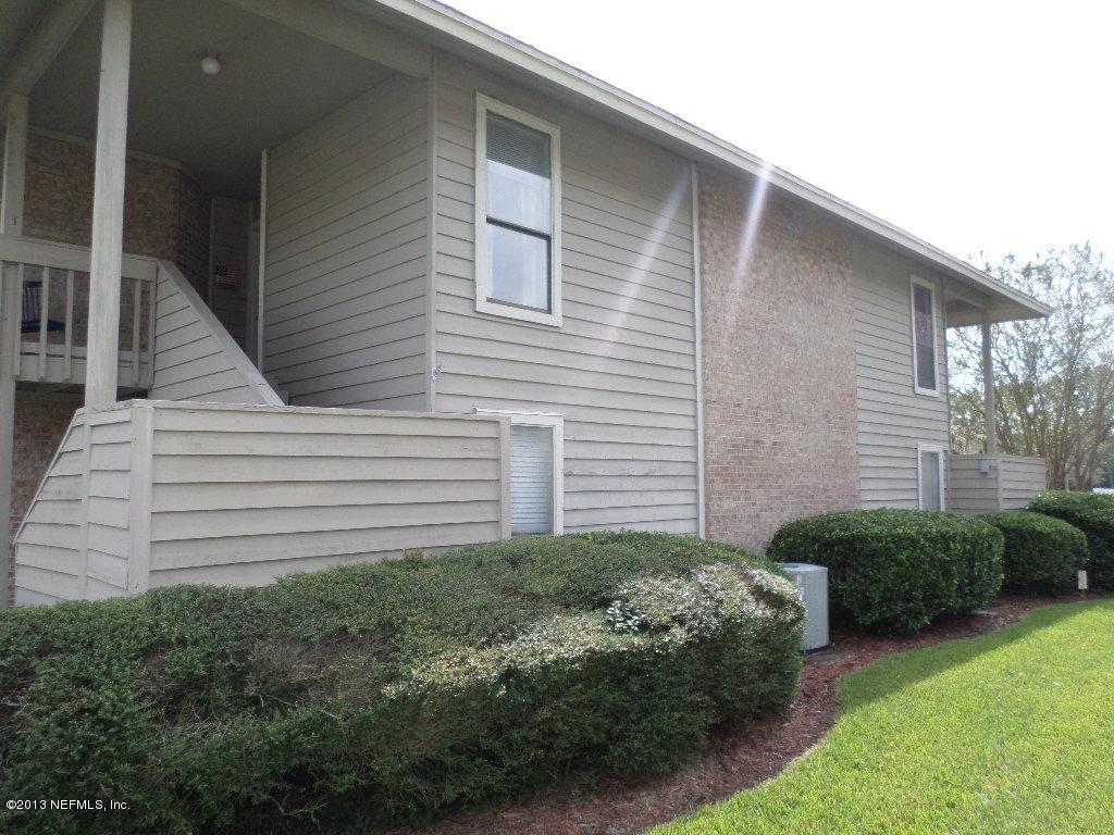 10200 Belle Rive Boulevard, Unit 69 Jacksonville, FL 32256 - Photo 16 of 17 a view of a backyard with plants