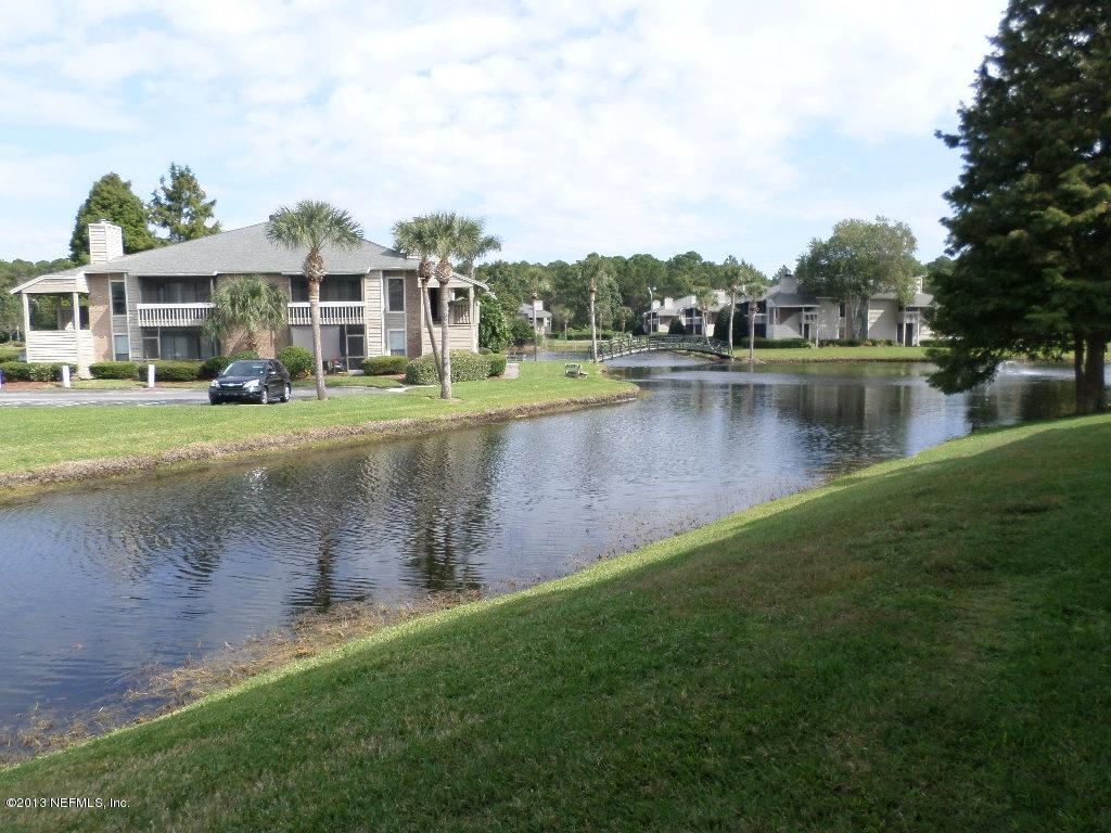 10200 Belle Rive Boulevard, Unit 69 Jacksonville, FL 32256 - Photo 17 of 17 a view of a lake with houses