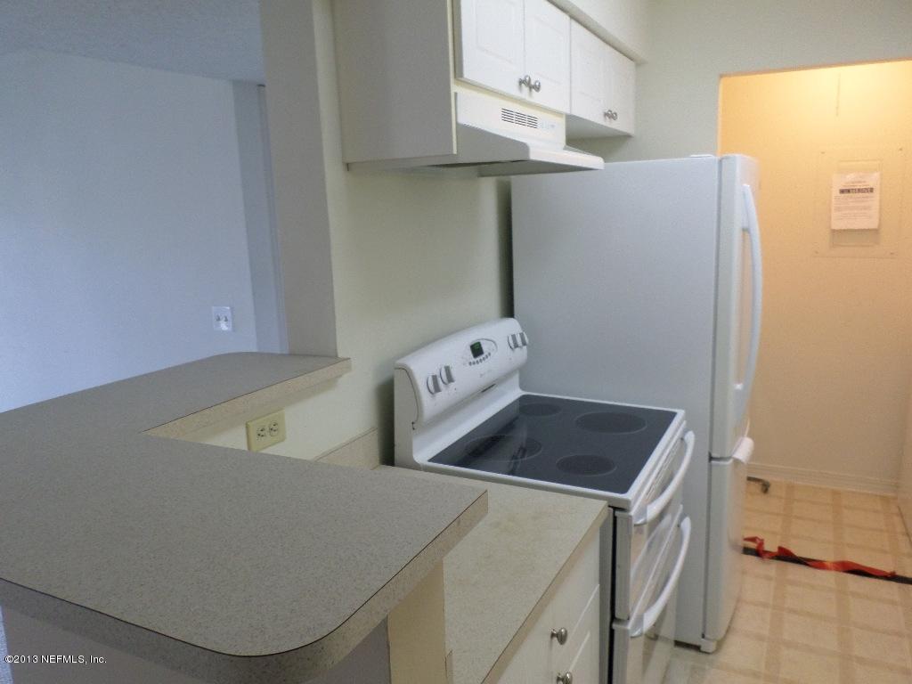 10200 Belle Rive Boulevard, Unit 69 Jacksonville, FL 32256 - Photo 5 of 17 a utility room with dryer and washer