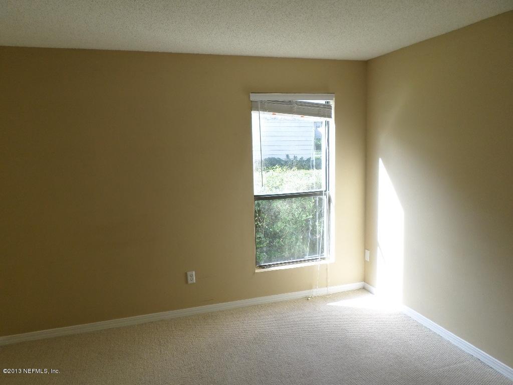 10200 Belle Rive Boulevard, Unit 69 Jacksonville, FL 32256 - Photo 9 of 17 an empty room with a window