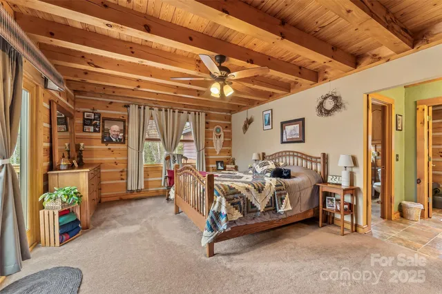 a bed room with furniture and a chandelier