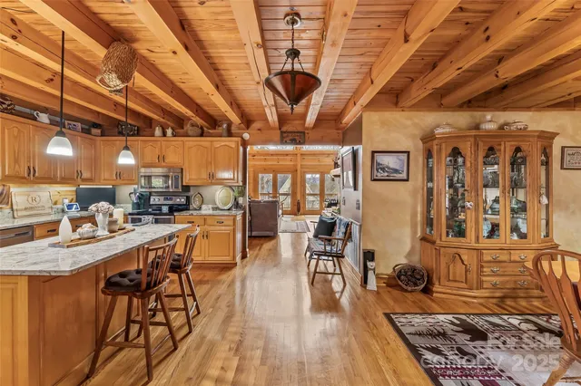 a very nice looking room with wooden floor and furniture