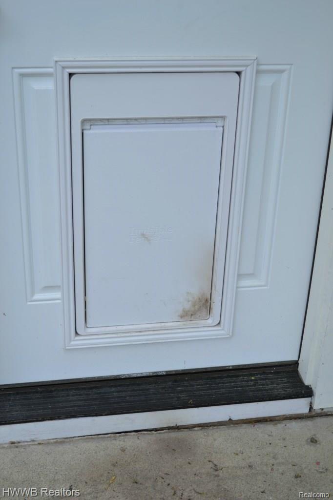 1481 Dutton Road Rochester, MI 48306 - Photo 26 of 55 Electronic Doggy Door into mudroom