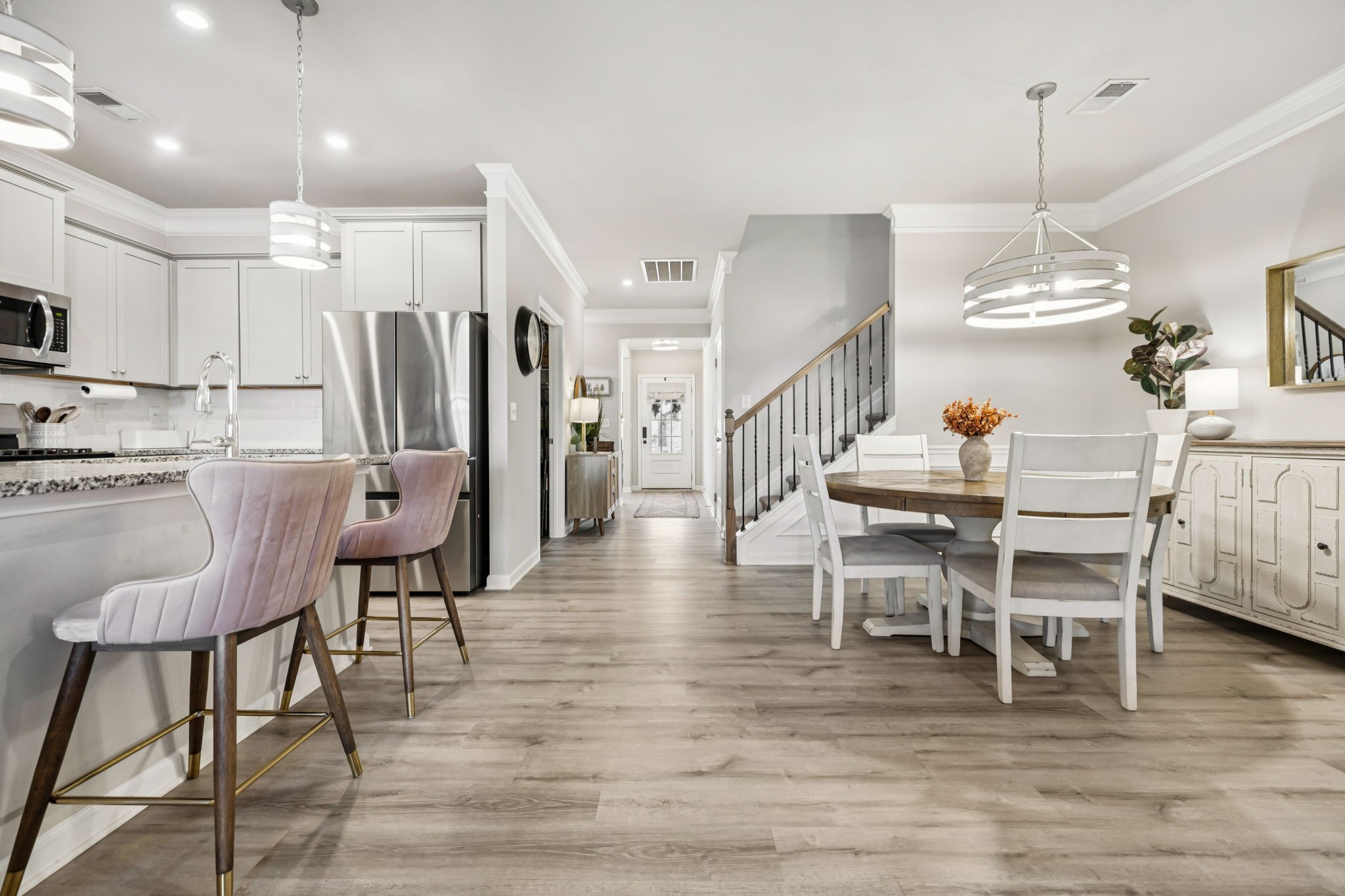 1077 Watermark Way Mount Juliet, TN 37122 - Photo 17 of 51 a dining room with furniture a chandelier and wooden floor