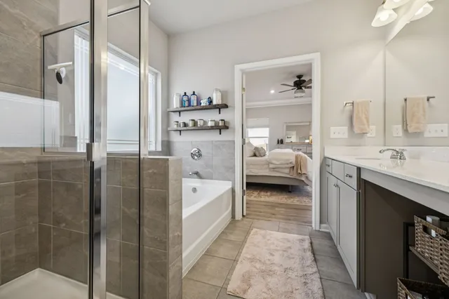 a bathroom with a tub and a shower