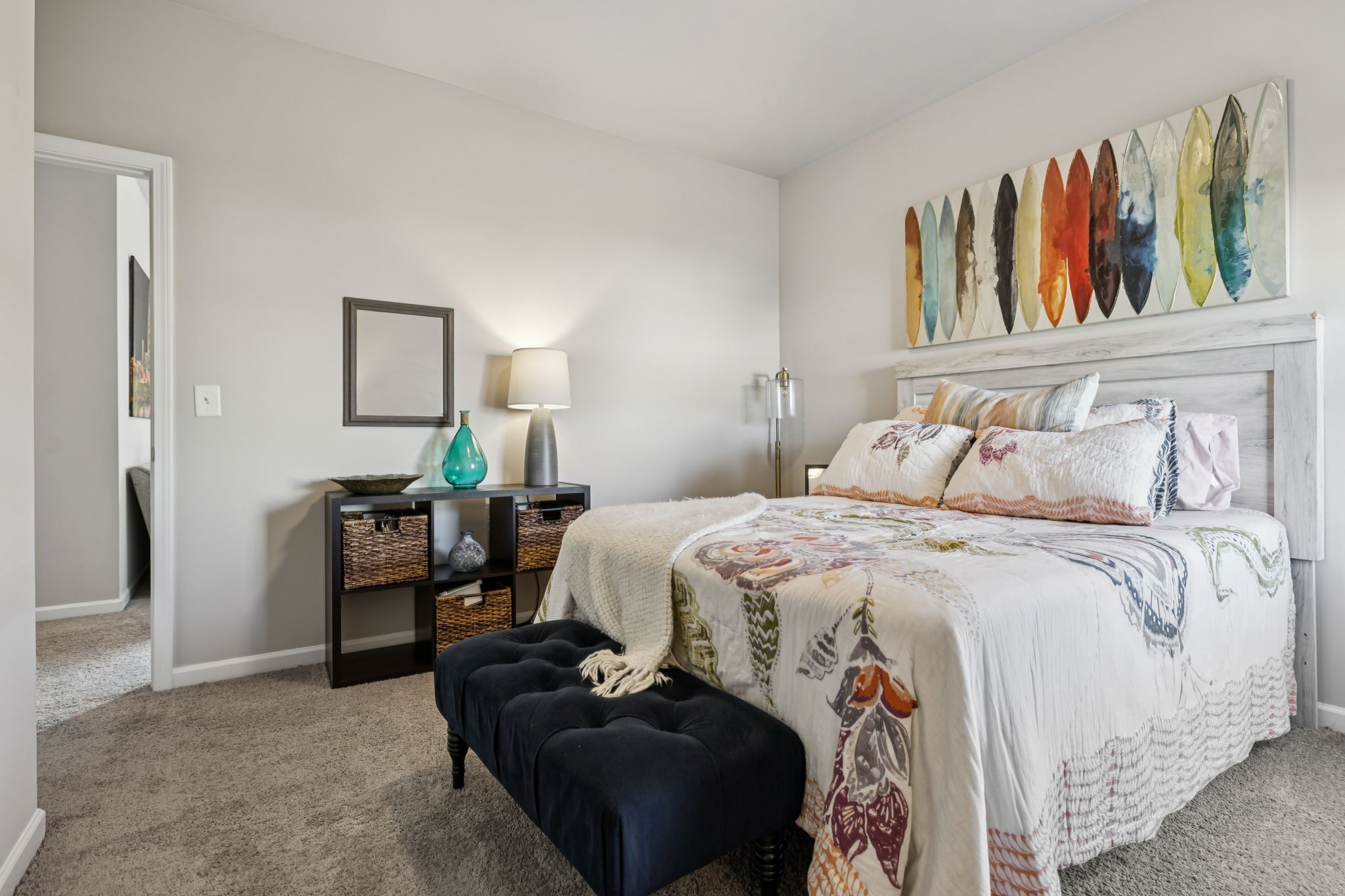 1077 Watermark Way Mount Juliet, TN 37122 - Photo 39 of 51 a bedroom with a bed a dresser and book shelf