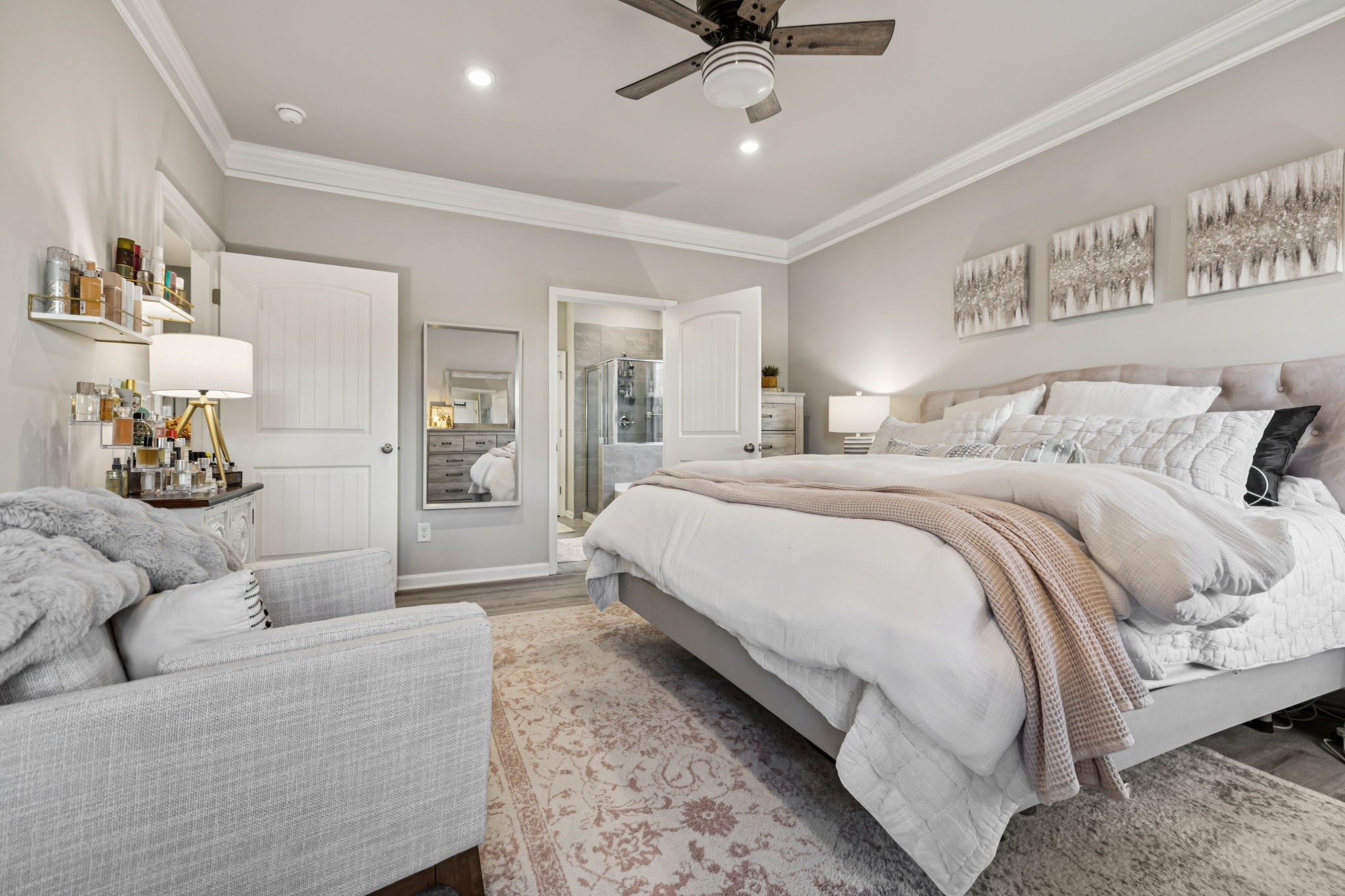 1077 Watermark Way Mount Juliet, TN 37122 - Photo 4 of 51 a spacious bedroom with a bed and ceiling fan