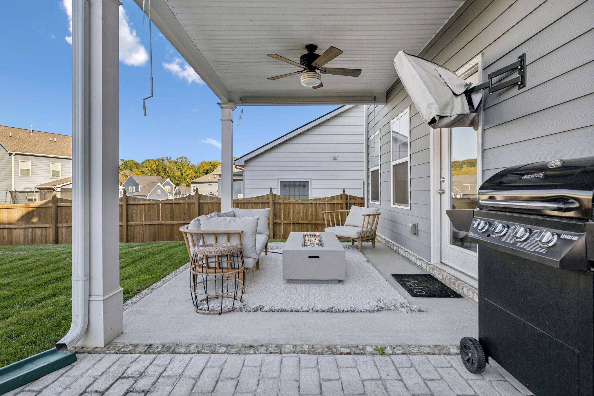 1077 Watermark Way Mount Juliet, TN 37122 - Photo 46 of 51 a view of a patio with a table chairs and a floor to ceiling window