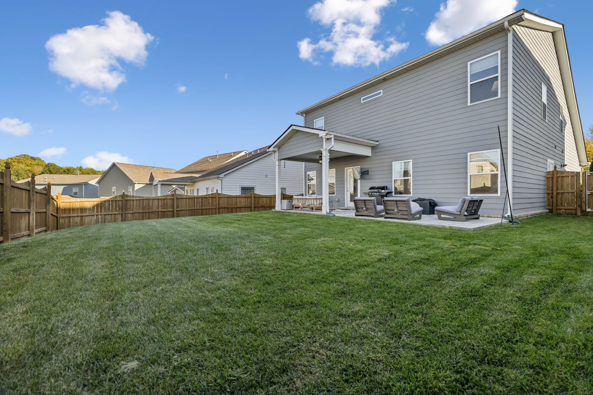 1077 Watermark Way Mount Juliet, TN 37122 - Photo 48 of 51 a view of a house with a backyard porch and sitting area