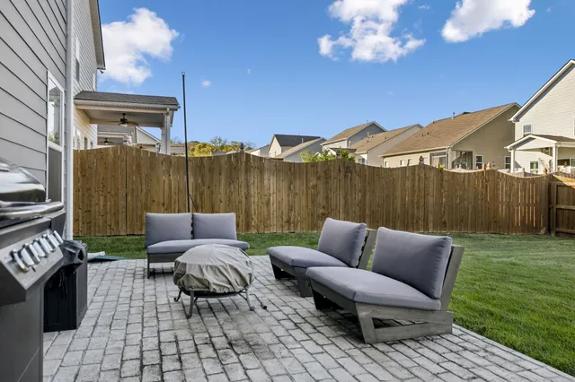 an aerial view of a house with a swimming pool