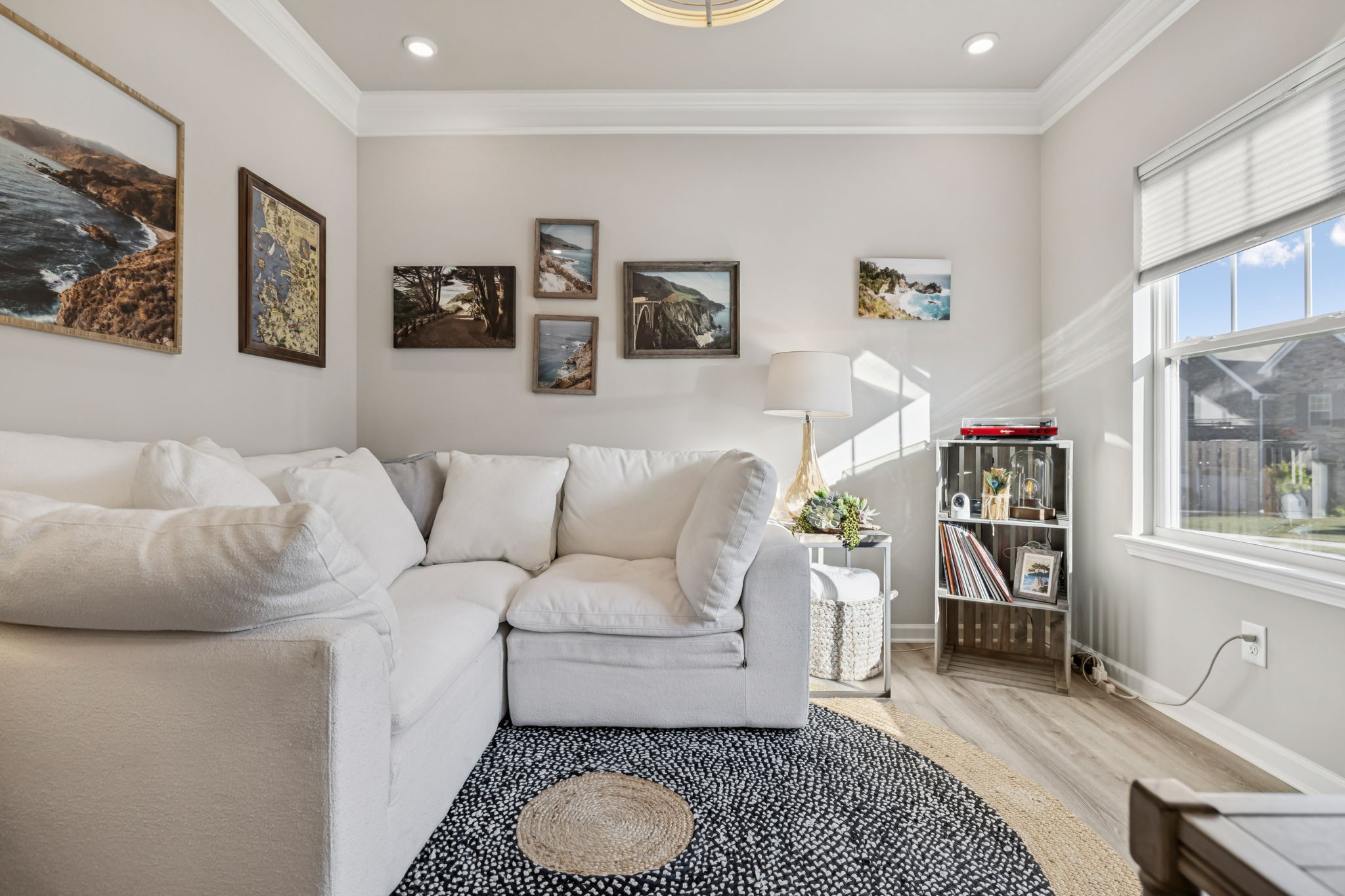 1077 Watermark Way Mount Juliet, TN 37122 - Photo 7 of 51 a living room with furniture a rug and wall painting