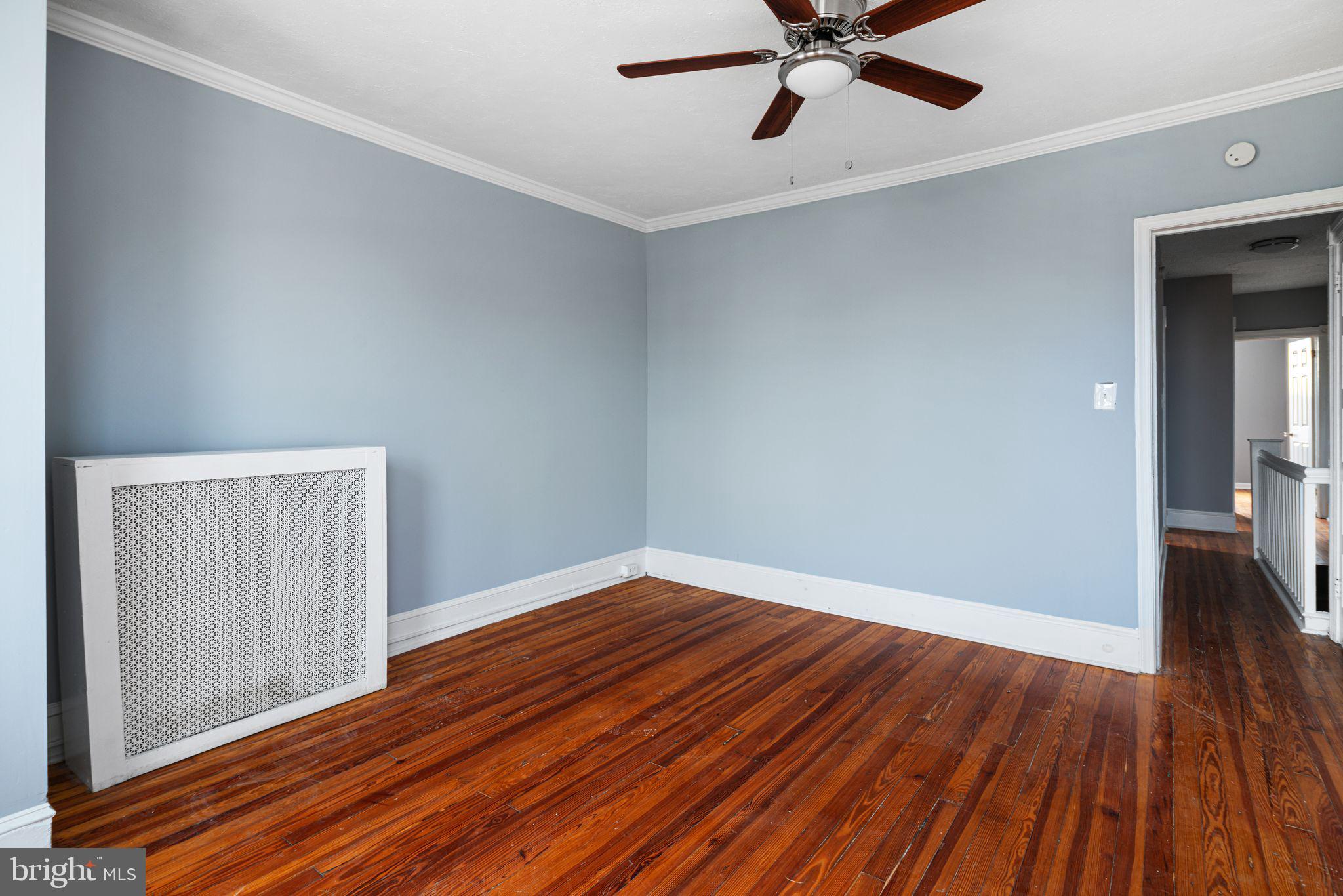 4606 Benner Street Philadelphia, PA 19135 - Photo 5 of 13 a view of an empty room with wooden floor