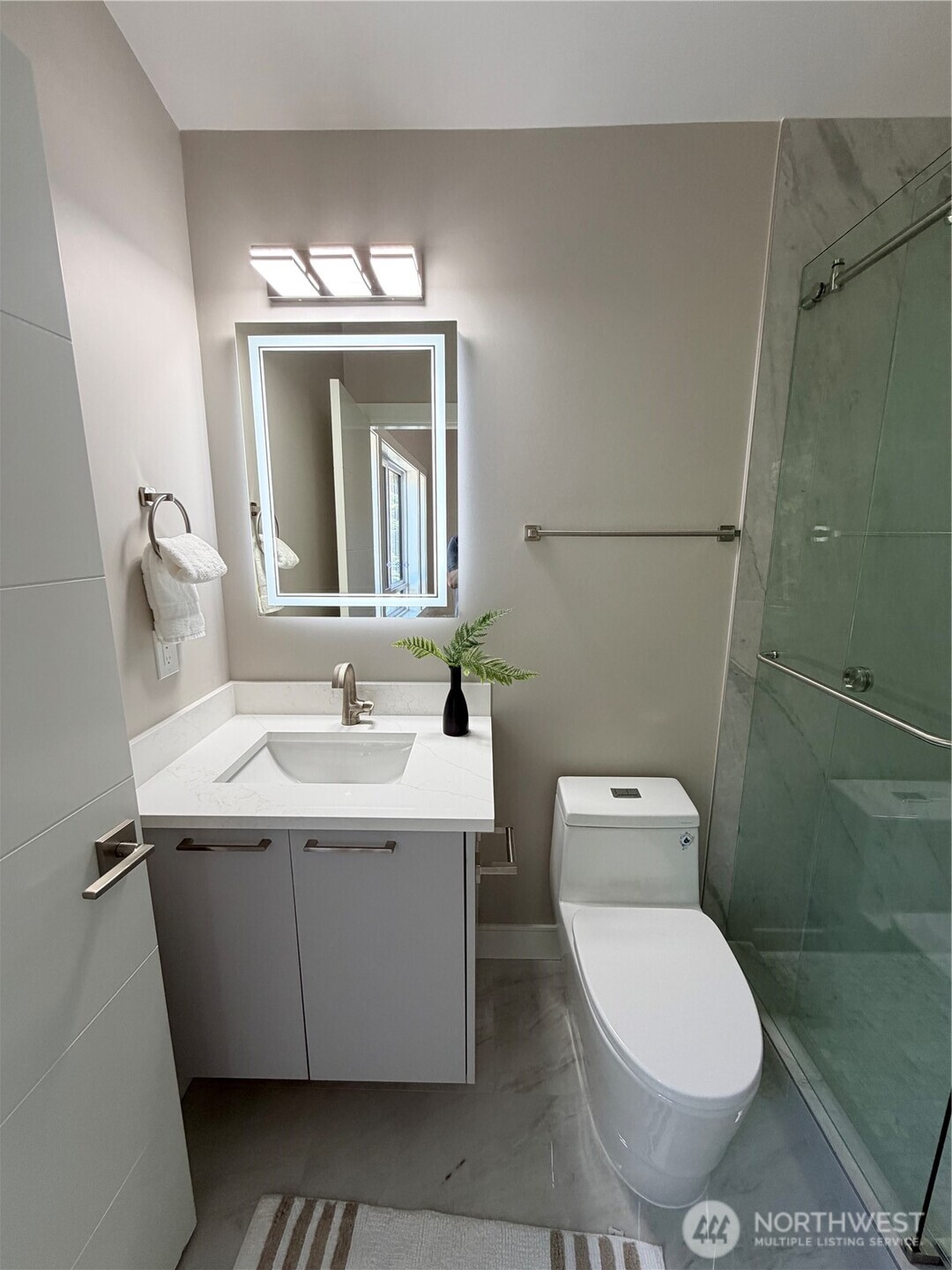 4305 Northeast 26th Court Renton, WA 98059 - Photo 24 of 40 a bathroom with a toilet sink and mirror