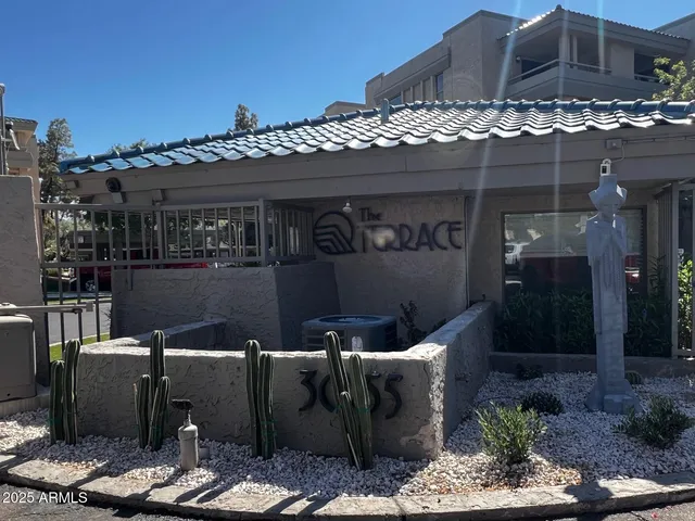 a terrace of a house with outdoor seating
