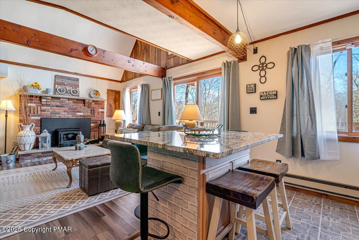 1037 Porter Drive Bushkill, PA 18324 - Photo 11 of 45 a kitchen with a table chairs stove and cabinets
