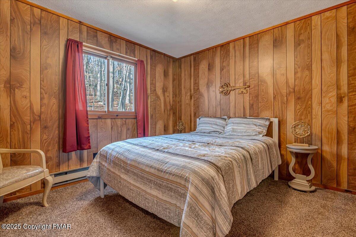 1037 Porter Drive Bushkill, PA 18324 - Photo 15 of 45 a bedroom with a bed and a window