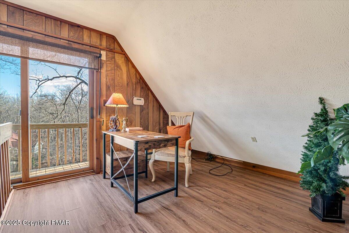 1037 Porter Drive Bushkill, PA 18324 - Photo 16 of 45 a view of a livingroom with furniture and hardwood floor