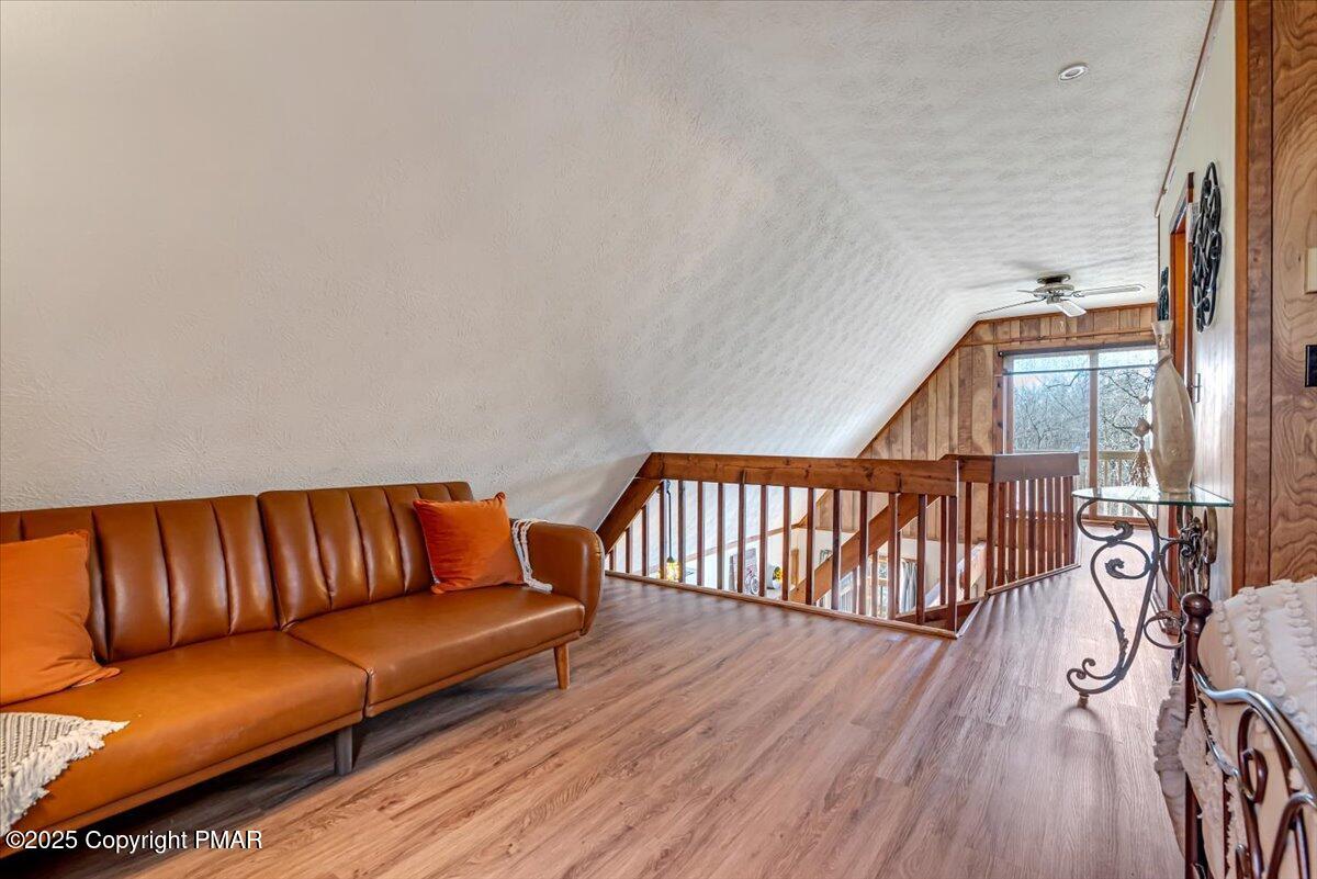 1037 Porter Drive Bushkill, PA 18324 - Photo 20 of 45 a blue couch sitting in a living room with a couch