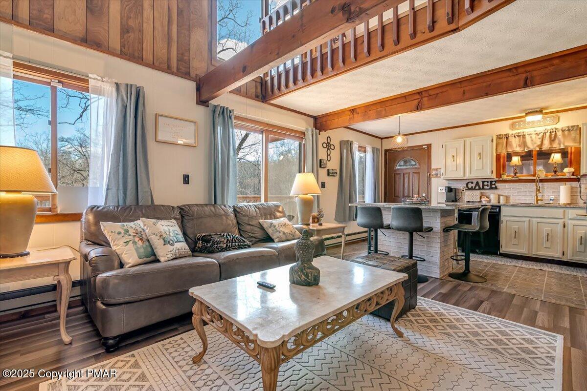 1037 Porter Drive Bushkill, PA 18324 - Photo 2 of 45 a living room with furniture a rug and kitchen view