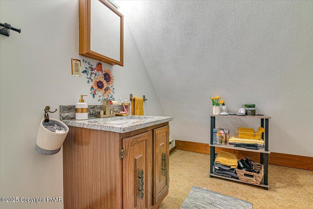 1037 Porter Drive Bushkill, PA 18324 - Photo 21 of 45 a room with sink and mirror
