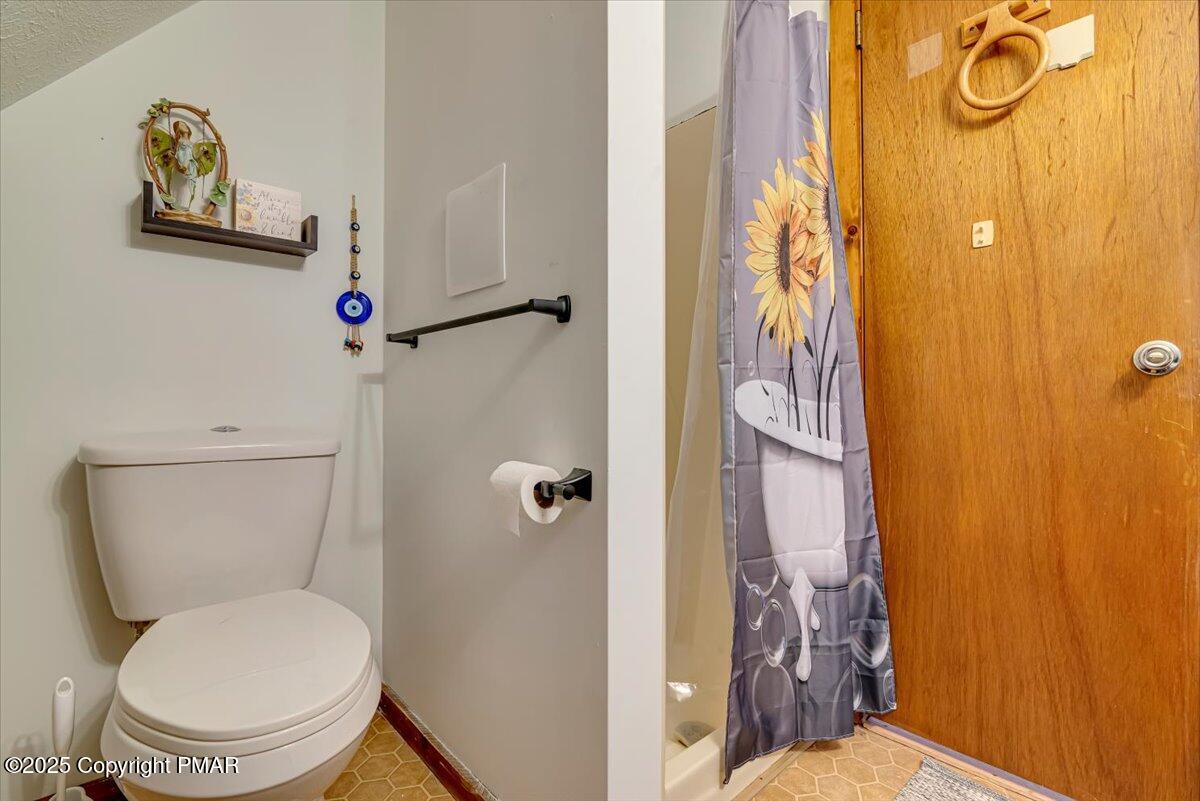 1037 Porter Drive Bushkill, PA 18324 - Photo 22 of 45 a bathroom with a toilet and a shower