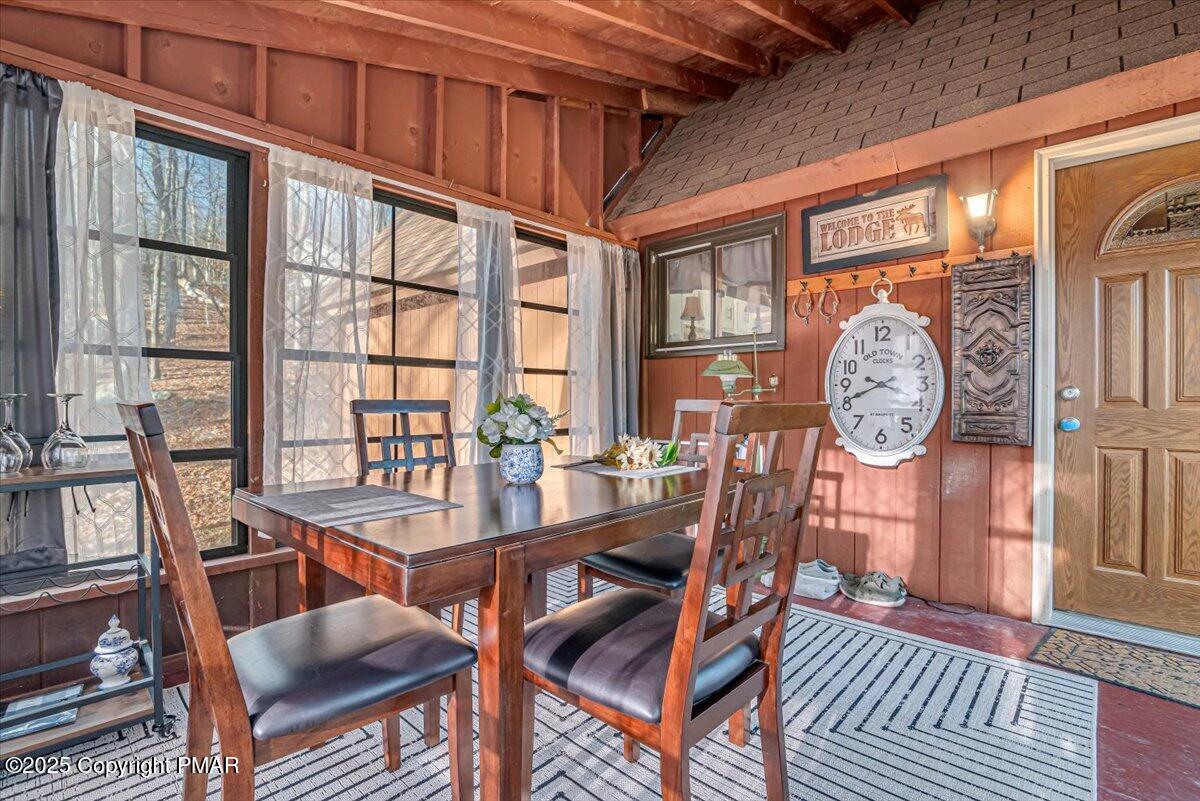 1037 Porter Drive Bushkill, PA 18324 - Photo 25 of 45 a view of a dining room with furniture window and wooden floor