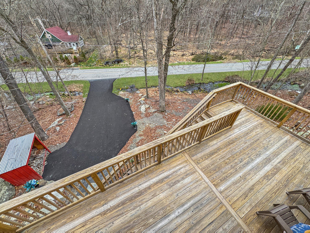1037 Porter Drive Bushkill, PA 18324 - Photo 27 of 45 a view of a balcony with wooden floor