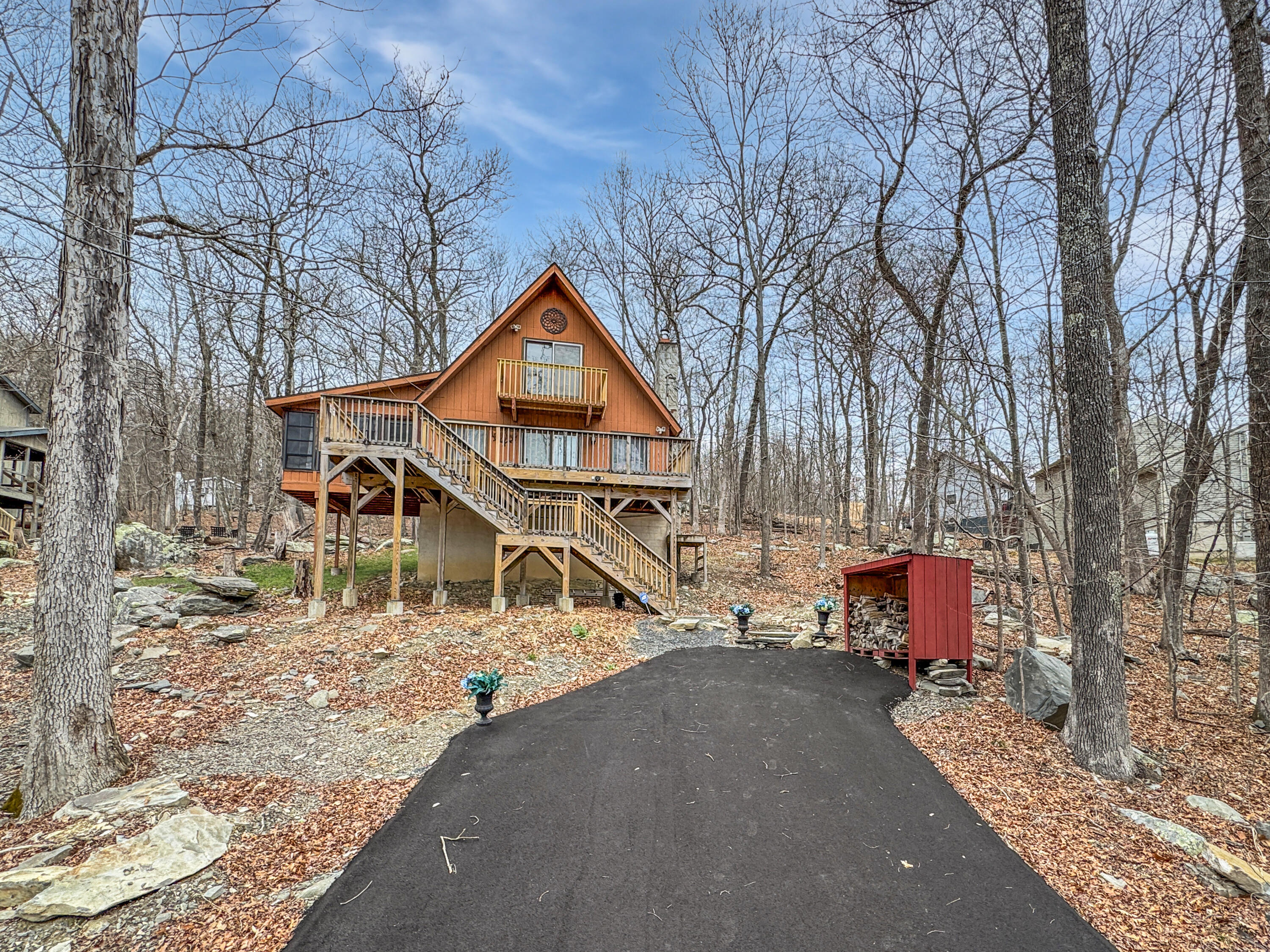 1037 Porter Drive Bushkill, PA 18324 - Photo 33 of 45 a house with trees in front of it