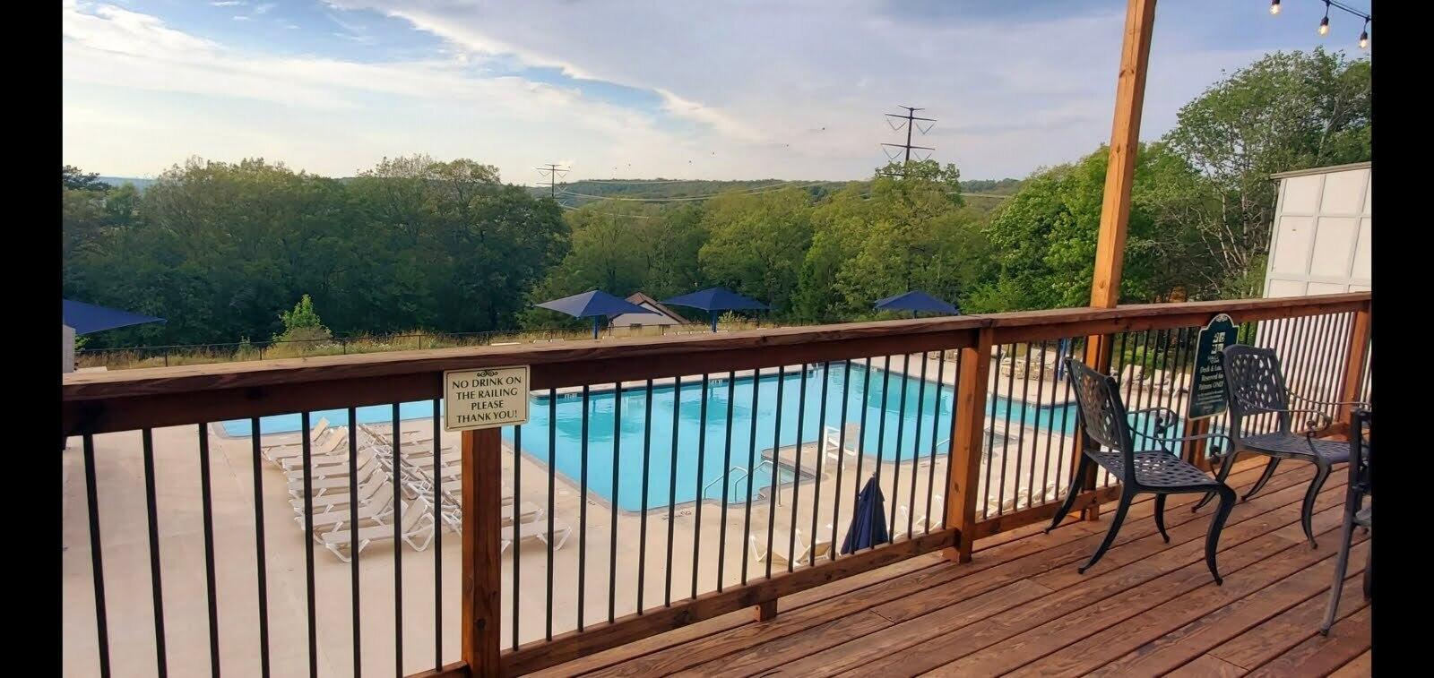 1037 Porter Drive Bushkill, PA 18324 - Photo 41 of 45 a view of a balcony with wooden floor & fence