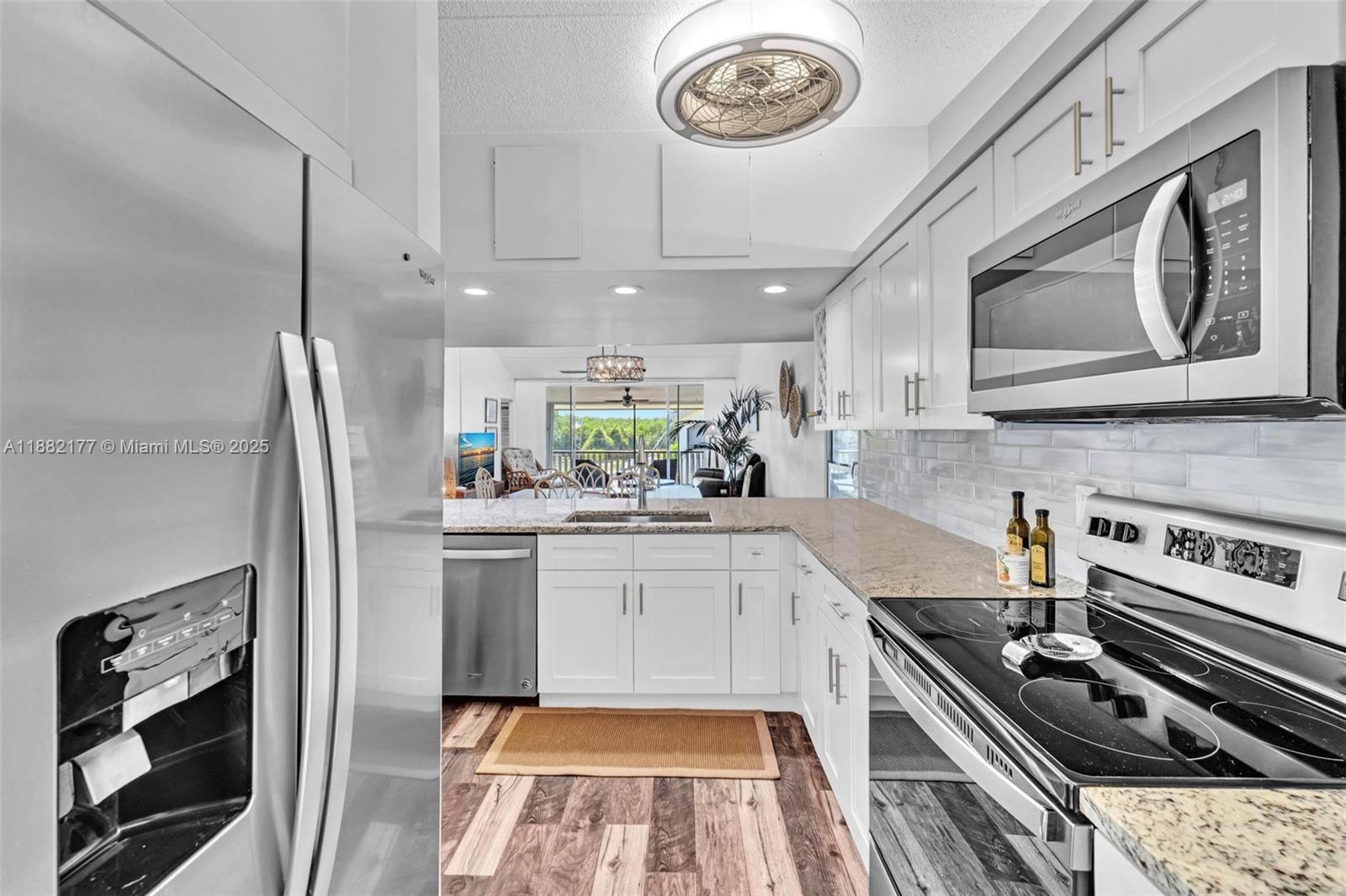 1456 Northeast Ocean Boulevard, Unit 7204 Stuart, FL 34996 - Photo 26 of 64 a kitchen with a stove oven and a sink